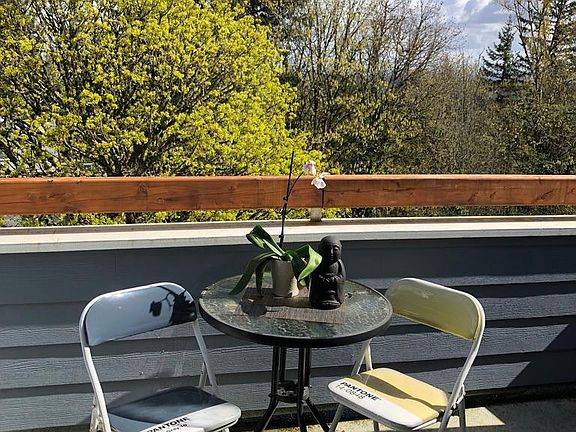 Top floor balcony with outdoor storage closet and outlet.