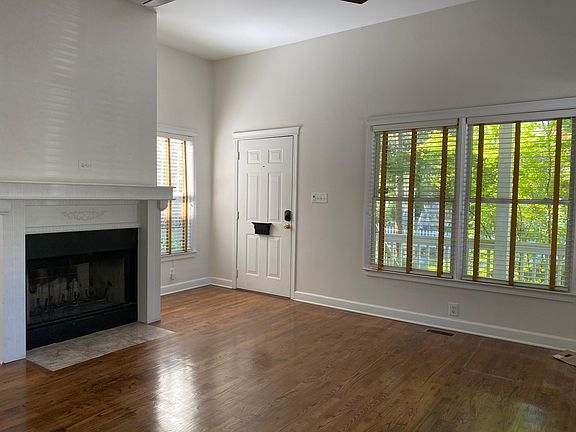 Living Room with gas starter fireplace. Windows overlook front porch.
