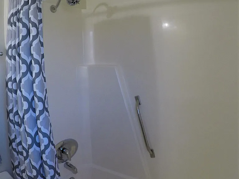 Master bath shower/tub combo with high mount shower nozzle
