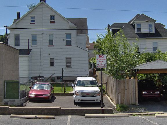 Back of home and parking pad area