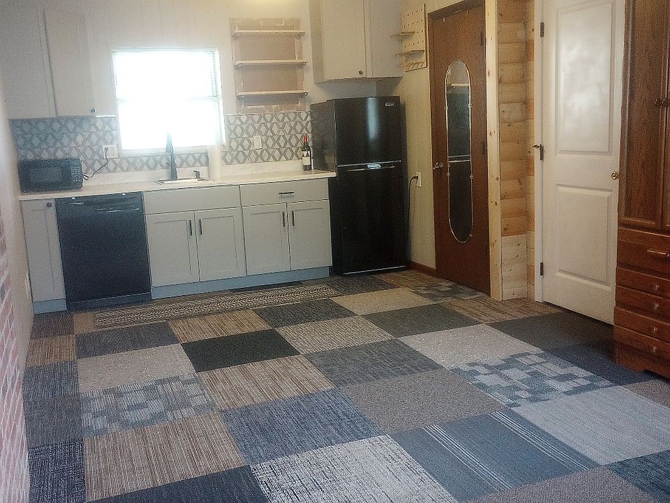 Partial view of the studio with kitchenette on one end.