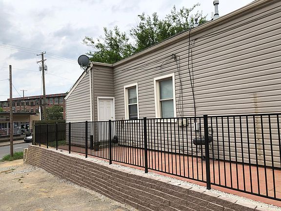Side entry way and NEWLY built patio July 2019