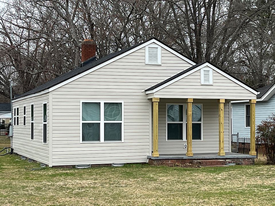 All new roof and exterior with heavy wood columns on (Large) front and back sitting porches.