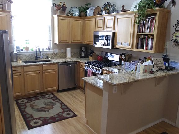 The kitchen with granite counters has a gas stove and extensive features.