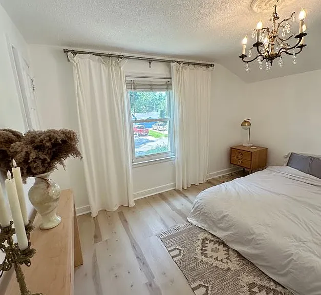 Second level king sized bed, bedroom 1. Blackout window treatments.