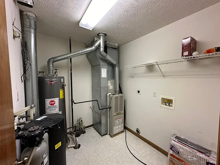 Utilities Closet with Washer Drier Hookups