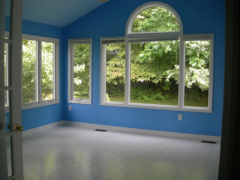 Sunroom Adjacent to Family Room. This room has been repainted.