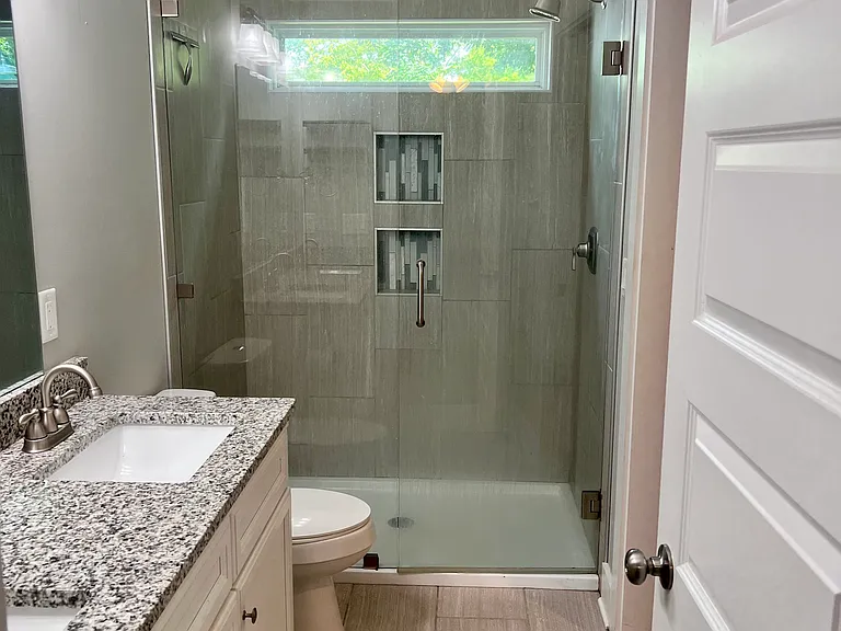 Master Bathroom with double vanity and glass door walk in shower