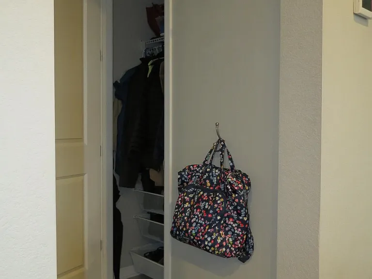 Coat closet includes shelving system for shoes