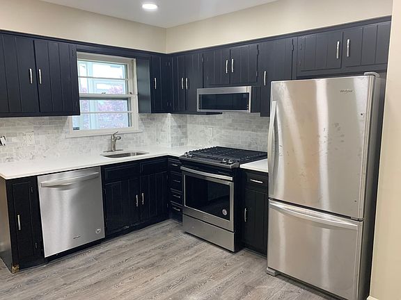 Main (second floor) Full eat in kitchen with new appliances, quartz counters and new flooring