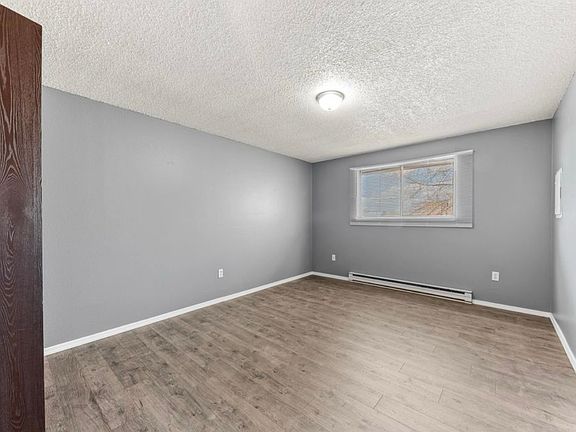 Large bedroom with new LVP flooring