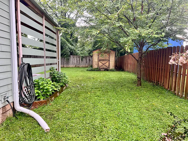 Side yard with view of shed. Shed is included for tenants use