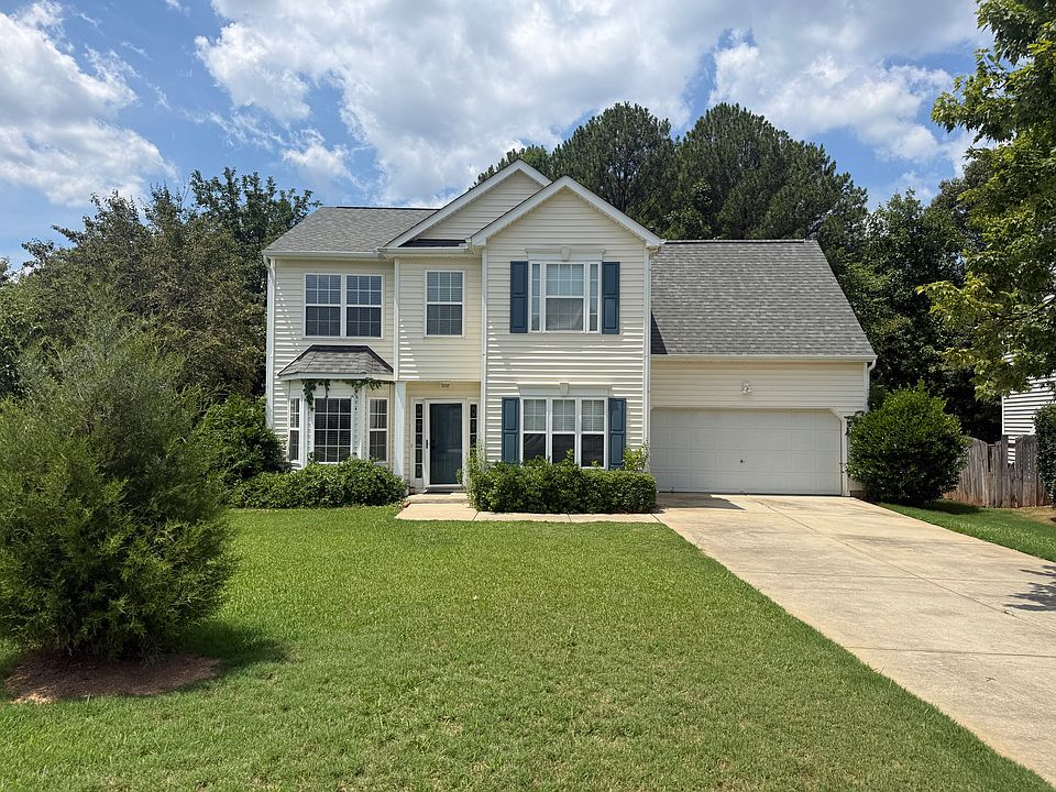 Front View with big lawn and spruce tree