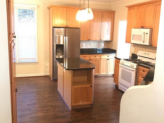 Kitchen - new stainless steel refrigerator and granite counter tops