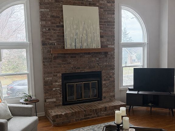Comfortable and south facing sunlit family room. Enjoy a wood burning fireplace during the winter. Open vaulted ceilings.