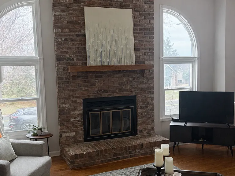 Comfortable and south facing sunlit family room. Enjoy a wood burning fireplace during the winter. Open vaulted ceilings.