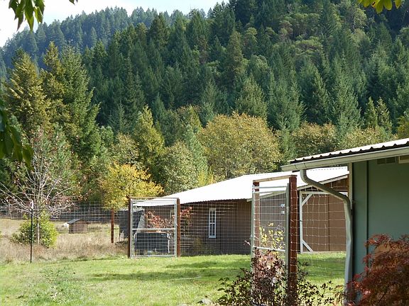 Barn with mts. behind 