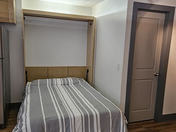 Full-sized bed with new mattress included.
