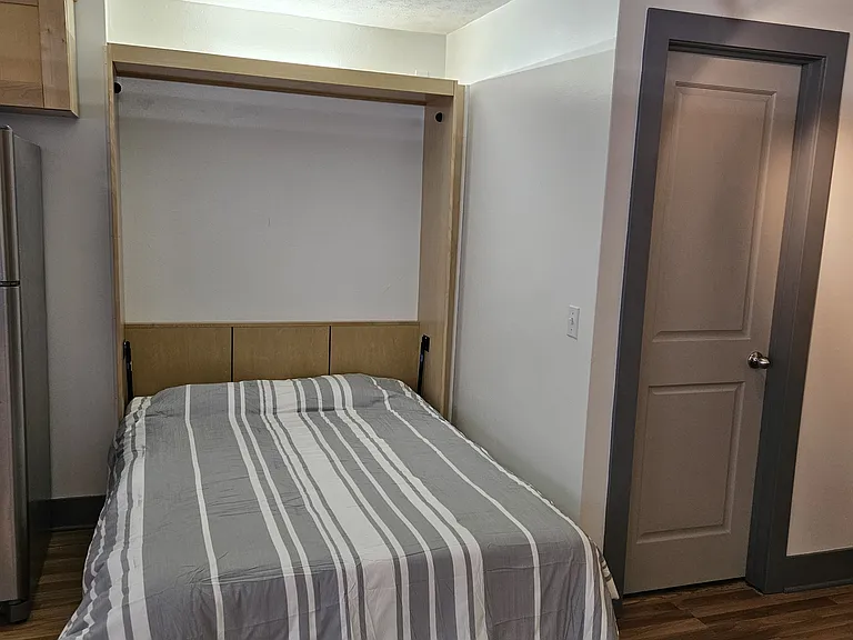 Full-sized bed with new mattress included.