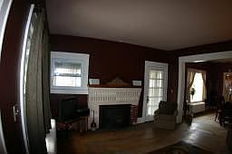 Living room with walkout to covered porch