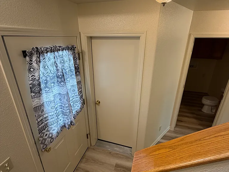 Door to the single car garage off the front entrance hall.