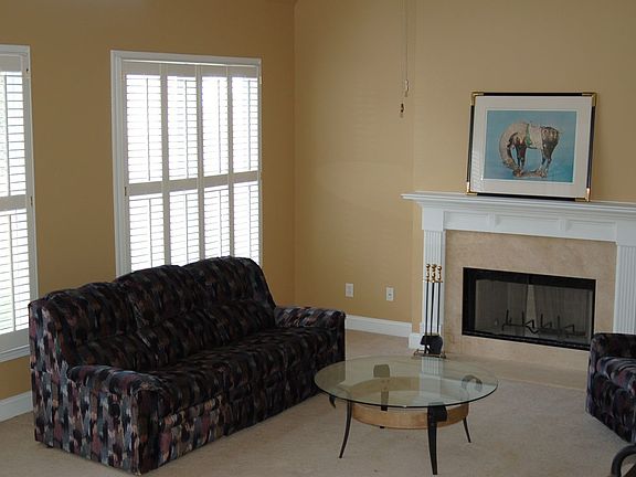 Marble Fireplace/Custom Wood Shutters