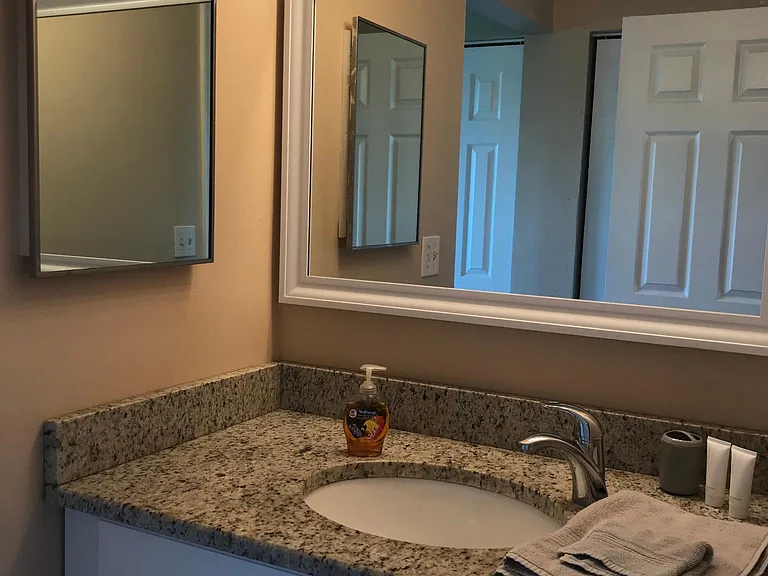 South bedroom private vanity and sink in bedroom.