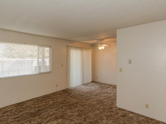 Sliding door leads to a patio. Dining room off sliding door which leads into the living room
