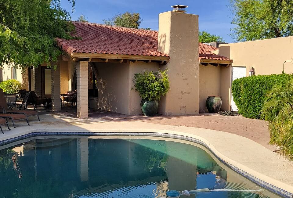 Enter through the gate past your private pool.