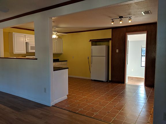 The kitchen as seen from the living room. The open door leads to the utility room.
