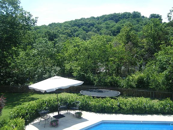 view of hill and woods from back porch