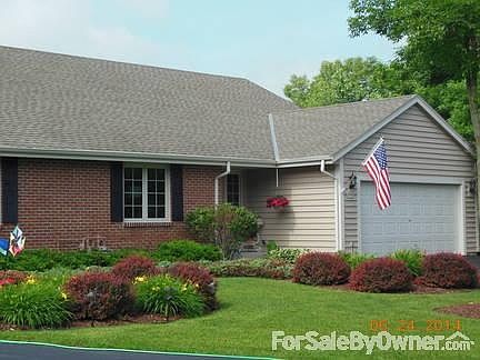 Entrance to Home
						:
						Side by side ranch with attached 2 car garage.