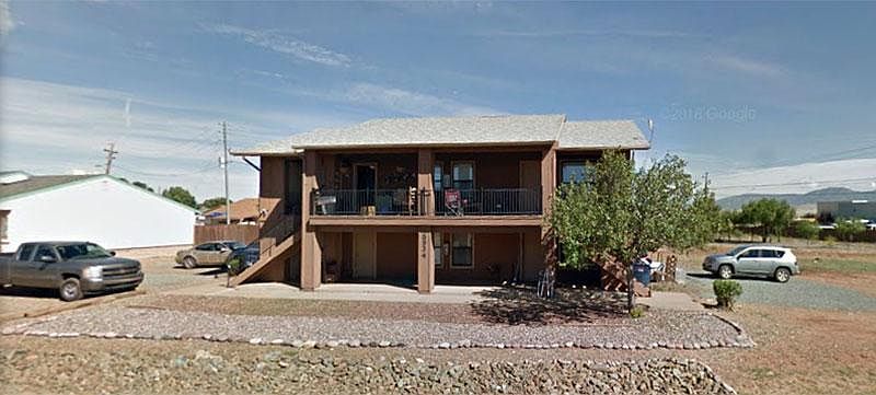 Front of building. Unit is located upstairs on the right. 