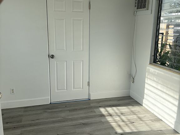 Door to additional storage or add a stackable washer/dryer