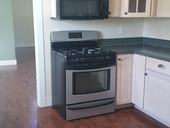 Kitchen opens to dining room and living room