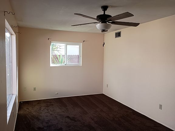 Living room with ceiling fan.