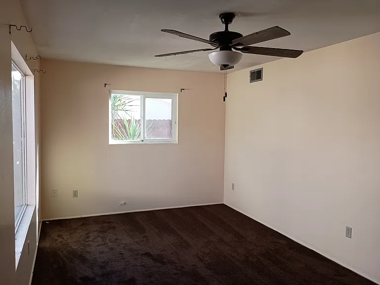 Living room with ceiling fan.