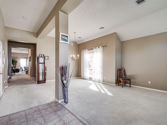 Entryway with formal living and dining to the right.
