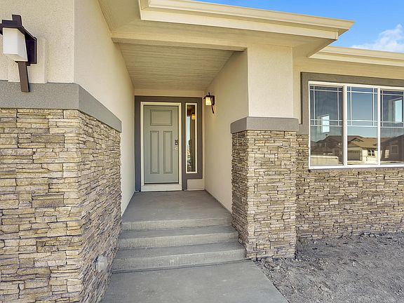 Welcoming Entry Photo representing home to be built and may demonstrate optional features