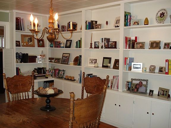 Tons of bookshelves in the dining room-great for storage!