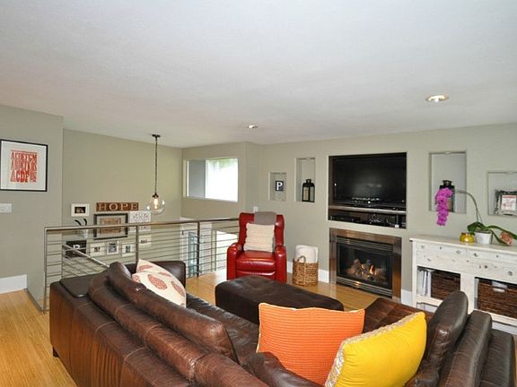 Beautiful entry with designer railings and etched glass front door invite you into the living room