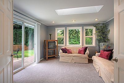Bonus room features skylight and slider to patio