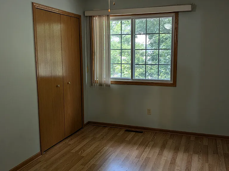 One upstairs bedroom has wooden flooring