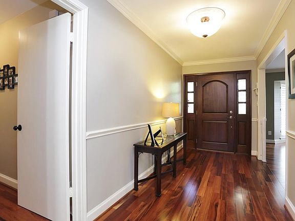 Behind the mahogany entry door there are Hartco Velenza solid Tigerwood floors throughout!