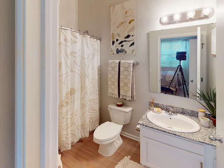 Relax in a Modern Bathroom with Granite Vanity at Ralston Apartments