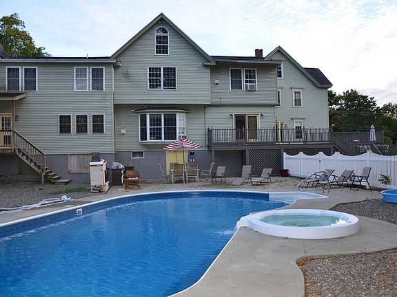 Back of house/pool area
						:
						18' x 40' heated pool with spillover spa