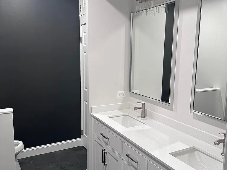 Primary en-suite bathroom, completely remodeled. 6-foot vanity, large linen closet, giant walk-in shower with bench.