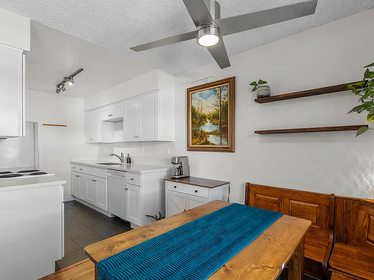 The dining area is equipped with a banquette that adds character as well as concealed storage. This can also be removed upon request.