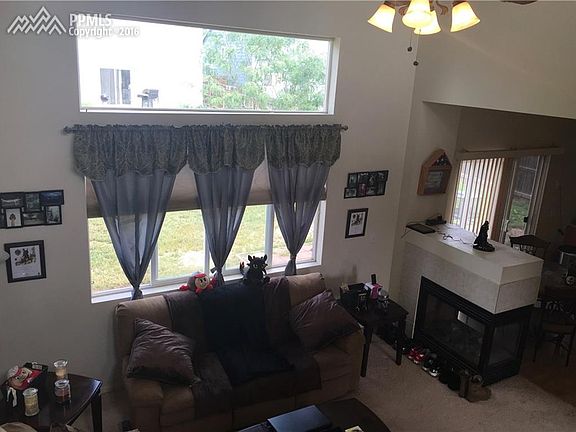 see through fireplace between living room and dining room.