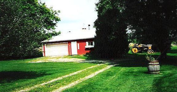 Pole barn behind house